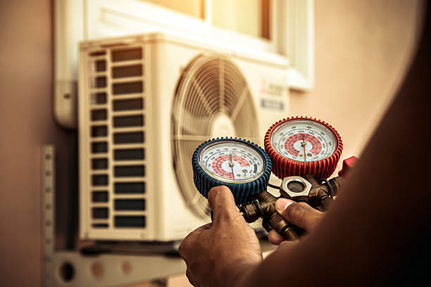 Professional Air Conditioning Service technician working in Battle Creek, MI